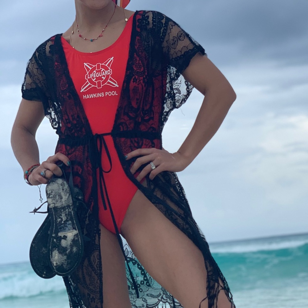 Red one piece swimsuit, low back.